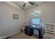 Cozy home office with neutral walls, carpeted floors, a window, a desk and two chairs at 650 N Hawes Rd # 4128, Mesa, AZ 85207