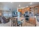 Open kitchen featuring an island with bar seating, stainless steel appliances, and stylish countertops at 650 N Hawes Rd # 4128, Mesa, AZ 85207