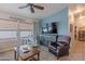 Comfortable living room with large windows, ceiling fan, and stylish decor at 650 N Hawes Rd # 4128, Mesa, AZ 85207