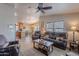 Open-concept living room flows into dining area with adjacent kitchen for easy entertaining at 650 N Hawes Rd # 4128, Mesa, AZ 85207