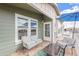 Inviting porch with comfortable seating, views of the community, and charming exterior details at 650 N Hawes Rd # 4128, Mesa, AZ 85207