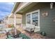 Inviting porch with comfortable seating, views of the community, and charming exterior details at 650 N Hawes Rd # 4128, Mesa, AZ 85207