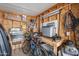 Organized storage shed featuring shelving, a workbench, and space for tools and equipment at 650 N Hawes Rd # 4128, Mesa, AZ 85207