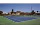 A close-up view of a pristine tennis court, perfect for enjoying a game in a beautiful outdoor setting at 650 N Hawes Rd # 4128, Mesa, AZ 85207