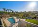 Aerial view showcasing the resort-style backyard with a pool, spa, tennis court, and lush landscaping at 6997 E Paradise Ranch Rd, Paradise Valley, AZ 85253