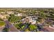 Desirable aerial view of sprawling backyard, pool, hot tub, tennis court, and covered outdoor space at 6997 E Paradise Ranch Rd, Paradise Valley, AZ 85253