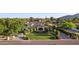 Expansive aerial view of a luxury home with manicured lawns, mature trees, and a circular driveway at 6997 E Paradise Ranch Rd, Paradise Valley, AZ 85253