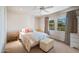 Bright bedroom with French doors, neutral decor, and a comfortable bed at 6997 E Paradise Ranch Rd, Paradise Valley, AZ 85253