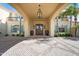 Grand entrance showcasing arched entryway, custom double doors, and elegant exterior lighting at 6997 E Paradise Ranch Rd, Paradise Valley, AZ 85253