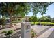 Inviting exterior view of a home featuring lush landscaping, a paver driveway, and a charming mailbox at 6997 E Paradise Ranch Rd, Paradise Valley, AZ 85253