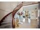 Grand foyer with a sweeping staircase, elegant decor, and views of the living area at 6997 E Paradise Ranch Rd, Paradise Valley, AZ 85253