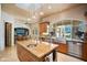 Spacious kitchen featuring a large island with sink, stainless steel appliances, and granite countertops at 6997 E Paradise Ranch Rd, Paradise Valley, AZ 85253