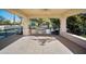 A well-equipped outdoor kitchen featuring a grill, storage space, and a tile backsplash at 6997 E Paradise Ranch Rd, Paradise Valley, AZ 85253
