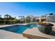 Sparkling swimming pool surrounded by lush landscaping, providing a serene and private oasis at 6997 E Paradise Ranch Rd, Paradise Valley, AZ 85253