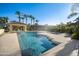Inviting swimming pool with a tanning ledge and water features, perfect for relaxation at 6997 E Paradise Ranch Rd, Paradise Valley, AZ 85253