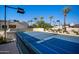 Private tennis court with lighting, offering a great way to stay active and enjoy the outdoors at 6997 E Paradise Ranch Rd, Paradise Valley, AZ 85253