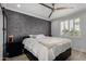 Inviting bedroom showcasing modern decor, accent wall, and shuttered windows at 706 E Washington St # 207, Phoenix, AZ 85034
