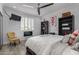 Cozy bedroom with a ceiling fan, comfortable bedding, and stylish decor at 706 E Washington St # 207, Phoenix, AZ 85034