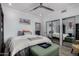 Bright bedroom with mirrored closets and comfortable furnishings at 706 E Washington St # 207, Phoenix, AZ 85034