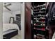 Bedroom closet with organized storage for shoes, clothing, and luggage at 706 E Washington St # 207, Phoenix, AZ 85034