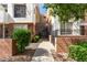 Townhome complex with secure gated access and lush landscaping at 706 E Washington St # 207, Phoenix, AZ 85034