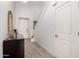Foyer with tiled floors, a staircase, and a decorative table with a mirror at 706 E Washington St # 207, Phoenix, AZ 85034