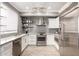 Modern kitchen with stainless steel appliances, white cabinetry, and attractive backsplash and countertops at 706 E Washington St # 207, Phoenix, AZ 85034