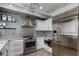 Modern kitchen with stainless steel appliances and white cabinetry at 706 E Washington St # 207, Phoenix, AZ 85034