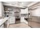 Modern kitchen with stainless steel appliances, white cabinetry, and attractive backsplash and countertops at 706 E Washington St # 207, Phoenix, AZ 85034