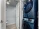 Convenient laundry area with modern stacked washer and dryer located next to the powder room at 706 E Washington St # 207, Phoenix, AZ 85034