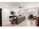 Spacious living room with a ceiling fan, tile floors, and bright white walls at 706 E Washington St # 207, Phoenix, AZ 85034