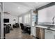 Open living space with modern decor, and a combined kitchen and dining area at 706 E Washington St # 207, Phoenix, AZ 85034