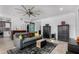 Comfortable living room featuring a leather couch, ceiling fan, and rustic decor at 706 E Washington St # 207, Phoenix, AZ 85034