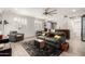 Cozy living room with a ceiling fan, natural light, tiled floors and a sofa with decorative pillows at 706 E Washington St # 207, Phoenix, AZ 85034