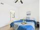 Bright and airy bedroom with a comfortable bed, and a view into the bathroom at 7101 W Beardsley Rd # 621, Glendale, AZ 85308
