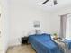 Cozy bedroom with a ceiling fan, a comfortable bed, and access to a private balcony at 7101 W Beardsley Rd # 621, Glendale, AZ 85308