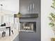 Modern fireplace featuring a dark mantel and tiled surround at 7101 W Beardsley Rd # 621, Glendale, AZ 85308