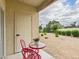 Charming patio area with a red bistro set and a view of the landscaped grounds at 7101 W Beardsley Rd # 621, Glendale, AZ 85308