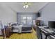 Bedroom with a ceiling fan, a work station and a bed at 7832 E Osage Ave, Mesa, AZ 85212