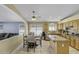 Bright kitchen with stainless steel appliances, granite countertops, and a breakfast nook dining area at 7832 E Osage Ave, Mesa, AZ 85212
