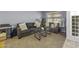 Comfortable living room with a sofa, loveseat, pillows, lamps and a glass table at 7832 E Osage Ave, Mesa, AZ 85212