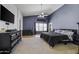 Spacious main bedroom with a ceiling fan, carpet flooring, and lots of natural light at 7832 E Osage Ave, Mesa, AZ 85212