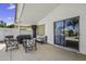 A covered patio features a seating area and an outdoor grill, perfect for relaxing and entertaining at 7832 E Osage Ave, Mesa, AZ 85212