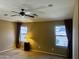 Bedroom featuring two windows, neutral walls, and carpet flooring for a comfortable feel at 830 E Dry Creek Rd, San Tan Valley, AZ 85143