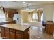 Large island in this kitchen connects to the living room and dining areas at 830 E Dry Creek Rd, San Tan Valley, AZ 85143