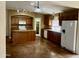 Spacious kitchen with an island, built-in microwave, pantry and plenty of counter space at 830 E Dry Creek Rd, San Tan Valley, AZ 85143