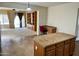 Kitchen island connects the Kitchen and living room in this open concept floor plan at 830 E Dry Creek Rd, San Tan Valley, AZ 85143