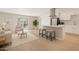 Bright, open living room featuring modern kitchen, stylish seating, and sliding glass door to patio at 8725 E Coronado Rd, Scottsdale, AZ 85257