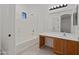 Bright bathroom with a tub, vanity, and marble flooring at 8745 W Windsor Dr, Peoria, AZ 85381