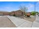 Charming single-story home featuring a well-maintained landscape and a long driveway at 8745 W Windsor Dr, Peoria, AZ 85381